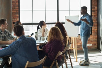 Man giving presentation to coworkers