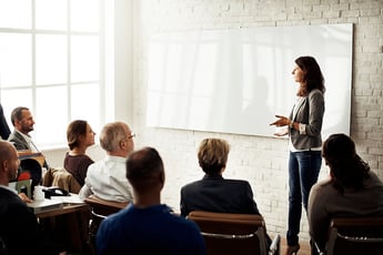 Woman giving training presentation at work
